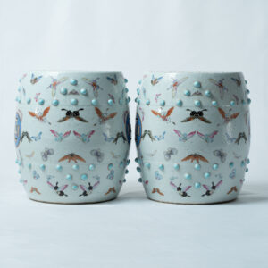 Lot 018 A PAIR OF FAMILLE-ROSE 'HUNDRED BUTTERFLIES' GARDEN STOOLS
LATE QING DYNASTY, 19TH CENTURY