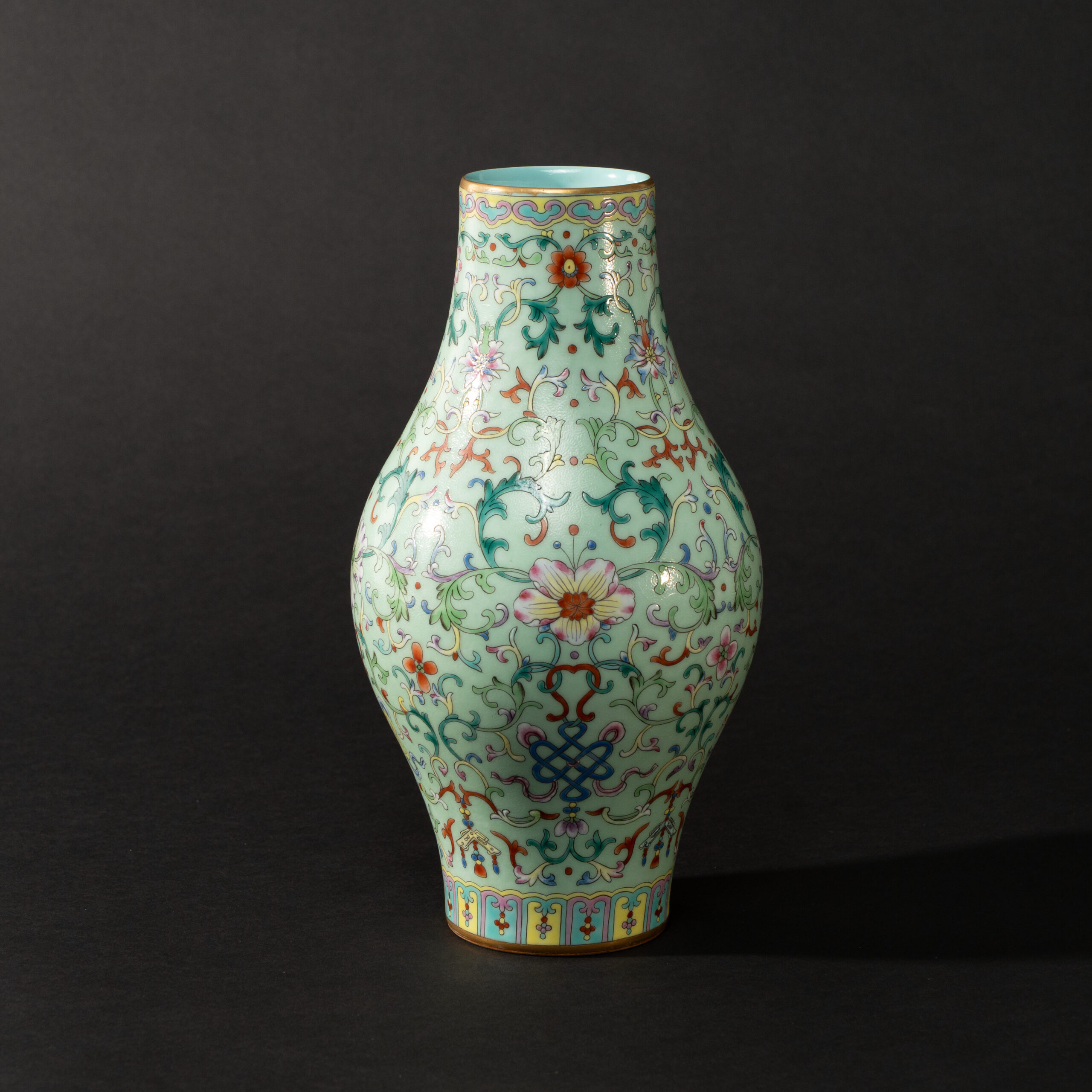 Lot 036 A LIME-GREEN GROUND FAMILLE-ROSE 'LOTUS' OLIVE-SHAPED VASE
20TH CENTURY, QIANLONG MARK