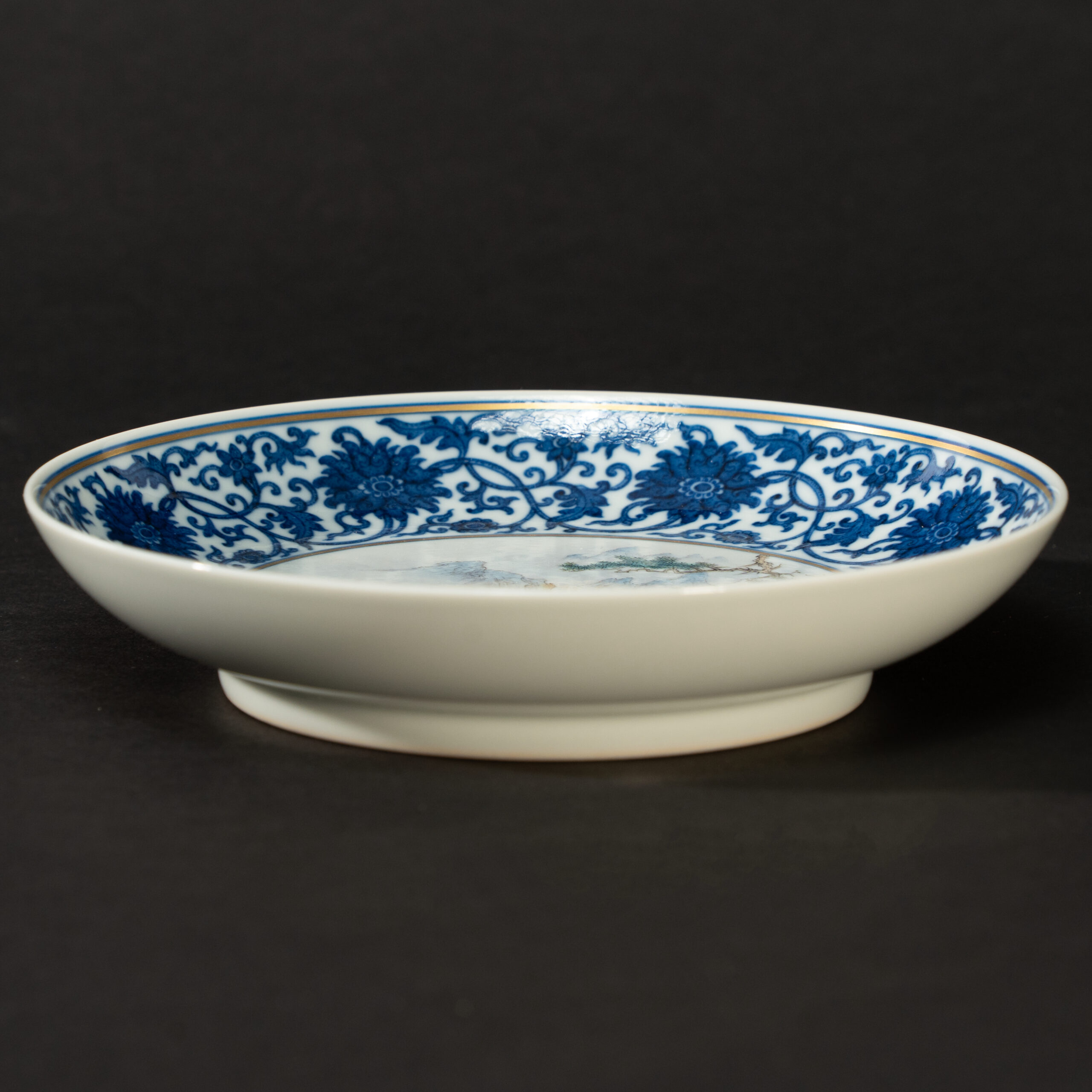Lot 046 A BLUE AND WHITE AND FAMILLE-ROSE 'BOY AND BUFFALO' DISH
20TH CENTURY, QIANLONG MARK