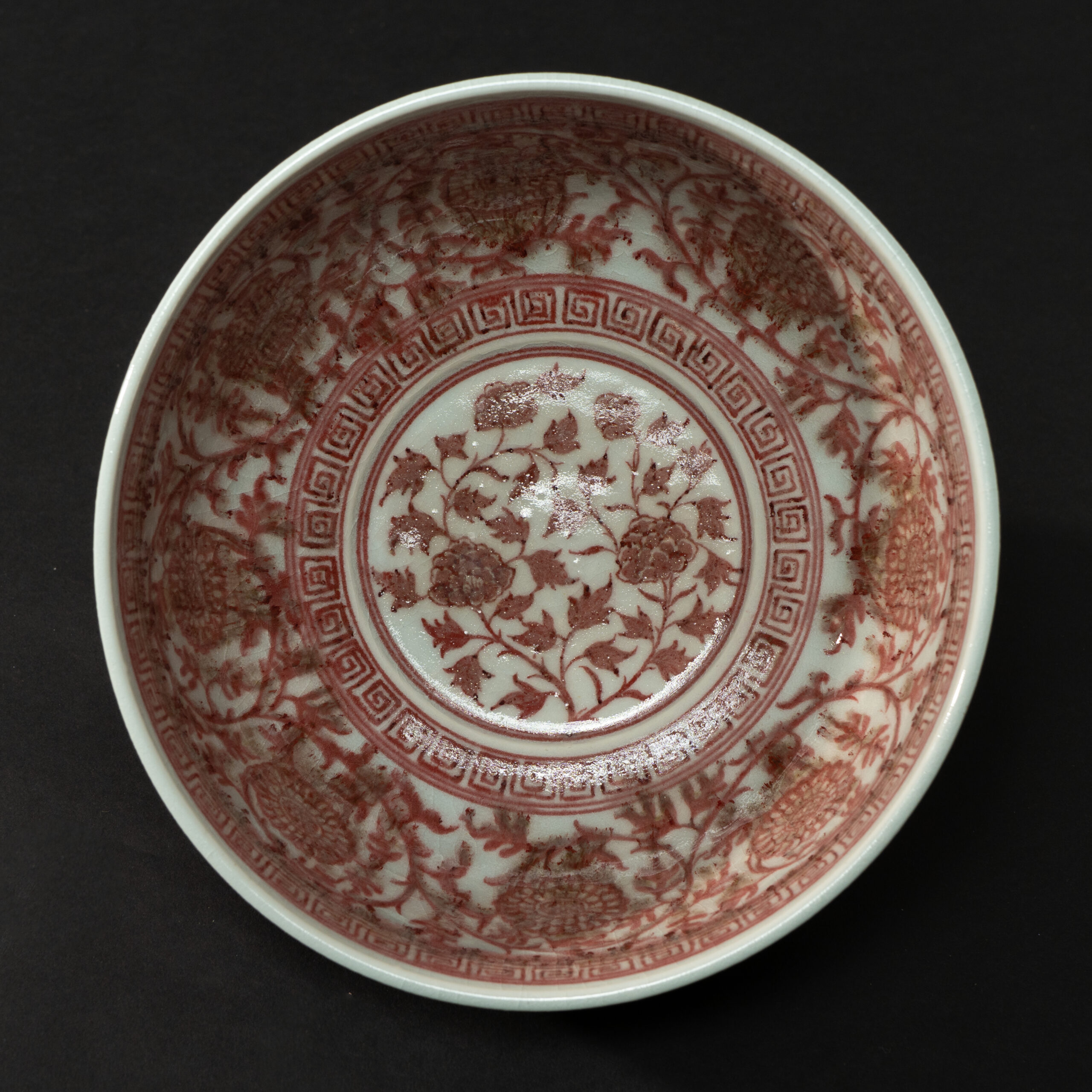 Lot 051 AN UNDERGLAZE-RED 'FLORAL SCROLL' BOWL
MING DYNASTY, 14TH - 15TH CENTURY - Image 2