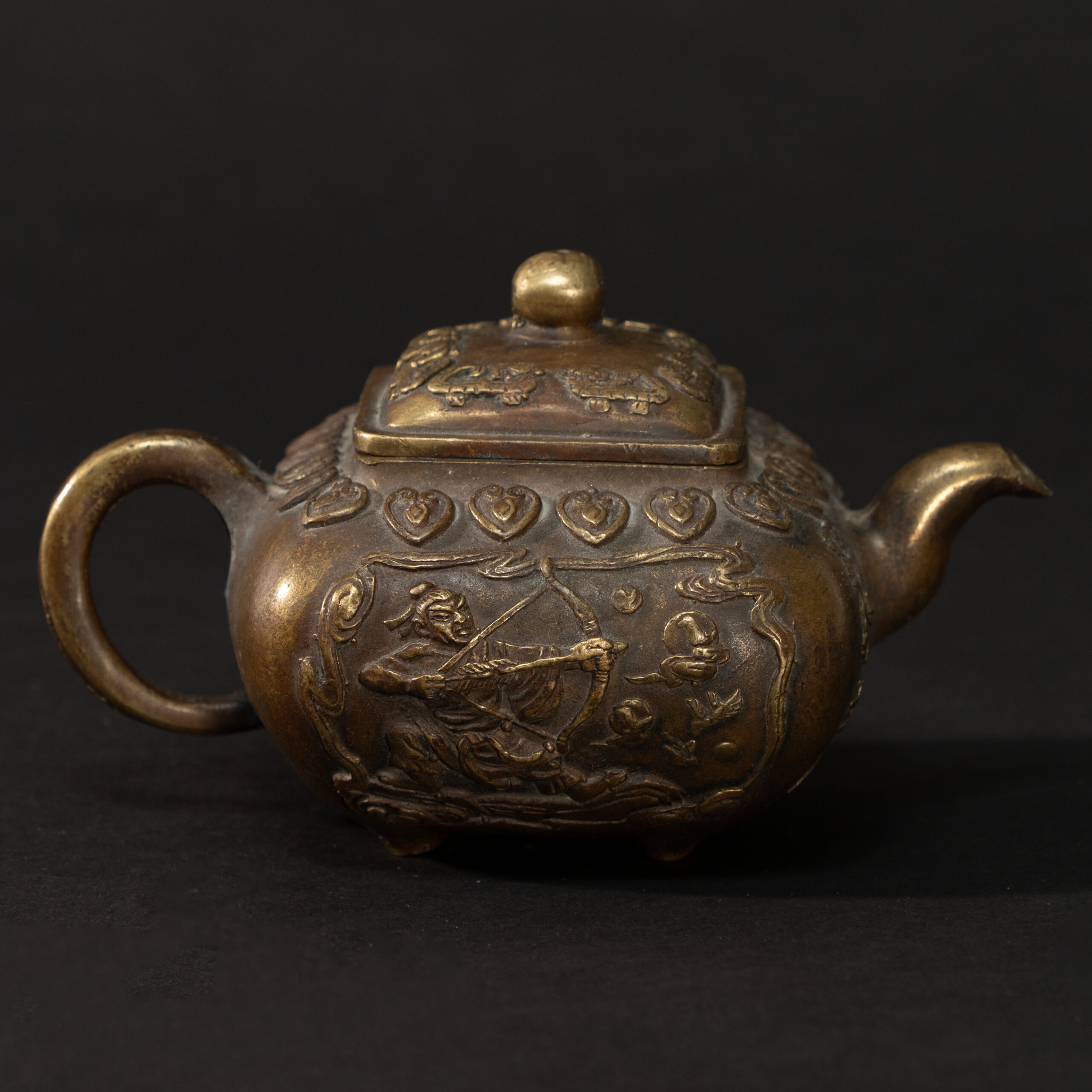 Lot 054 A REPOUSSÉ BRONZE 'MYTHOLOGICAL FIGURES' QUADRANGULAR TEAPOT
LATE QING DYNASTY - REPUBLIC PERIOD