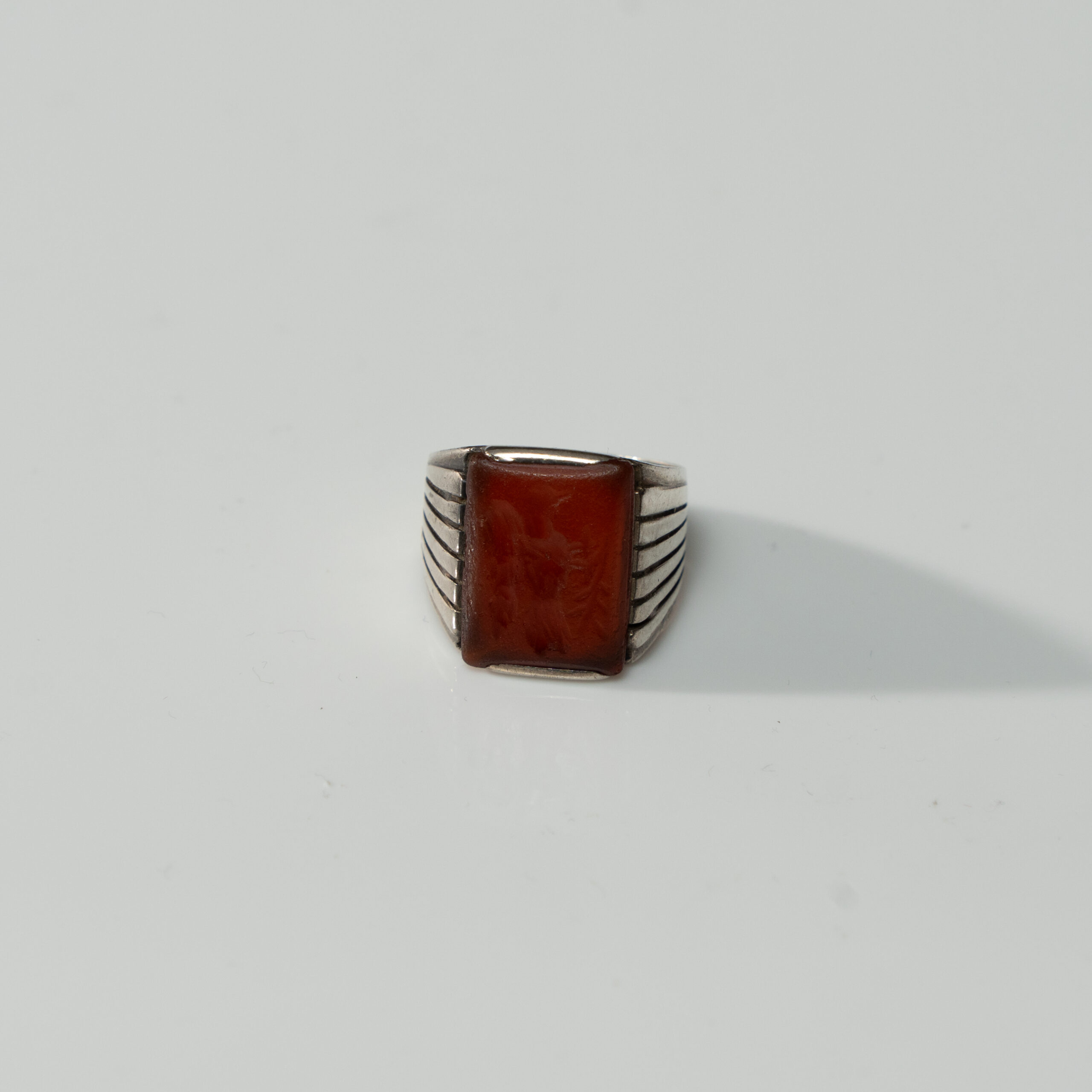 Lot 064 A GRECO-ROMAN BROWN AGATE 'SYMBOLIC BIRD' INTAGLIO RING
CIRCA 1ST CENTURY BCE – 2ND CENTURY CE