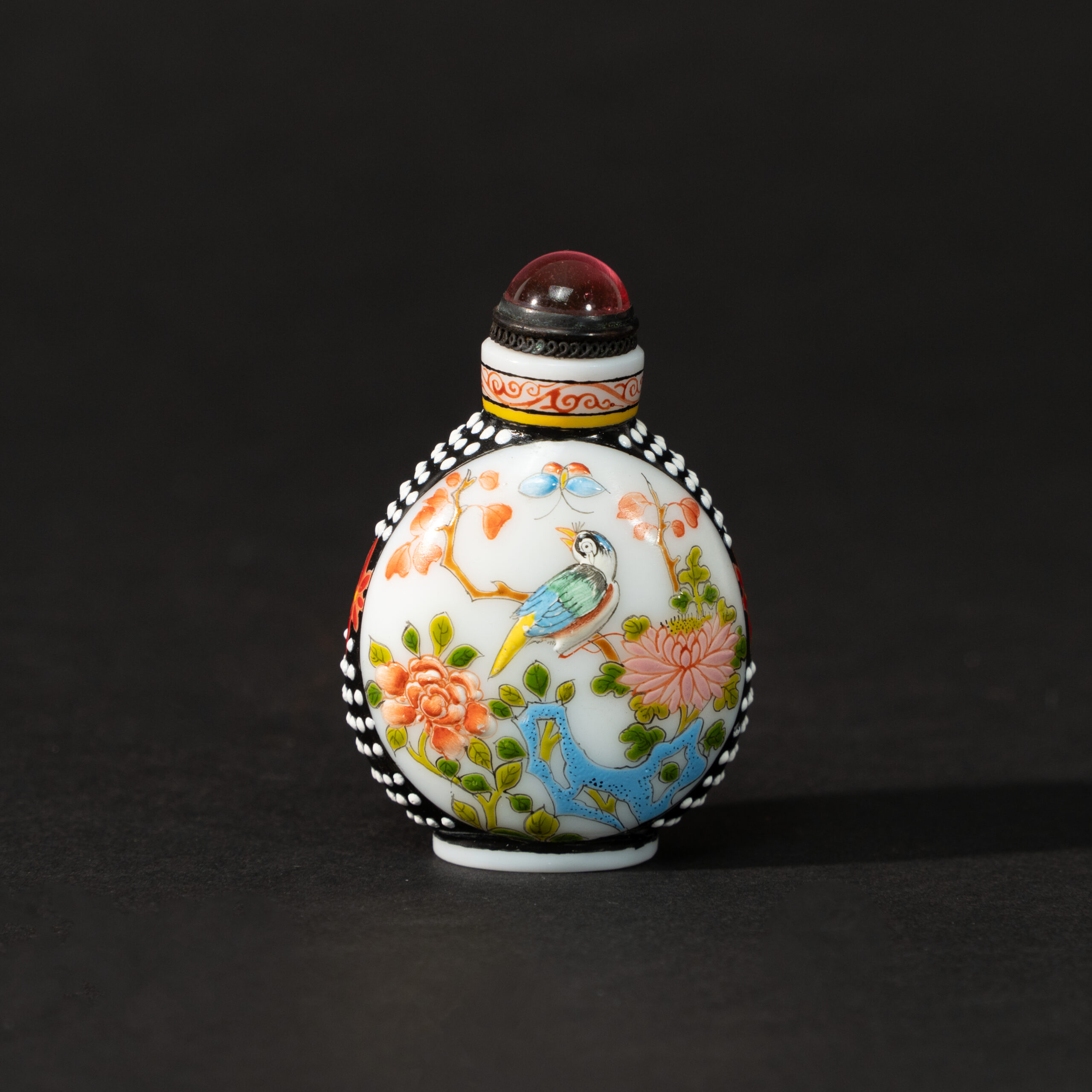 Lot 076 A FINE PAINTED ENAMEL ON GLASS 'FLOWERS AND BIRDS' SNUFF BOTTLE
20TH CENTURY, QIANLONG MARK