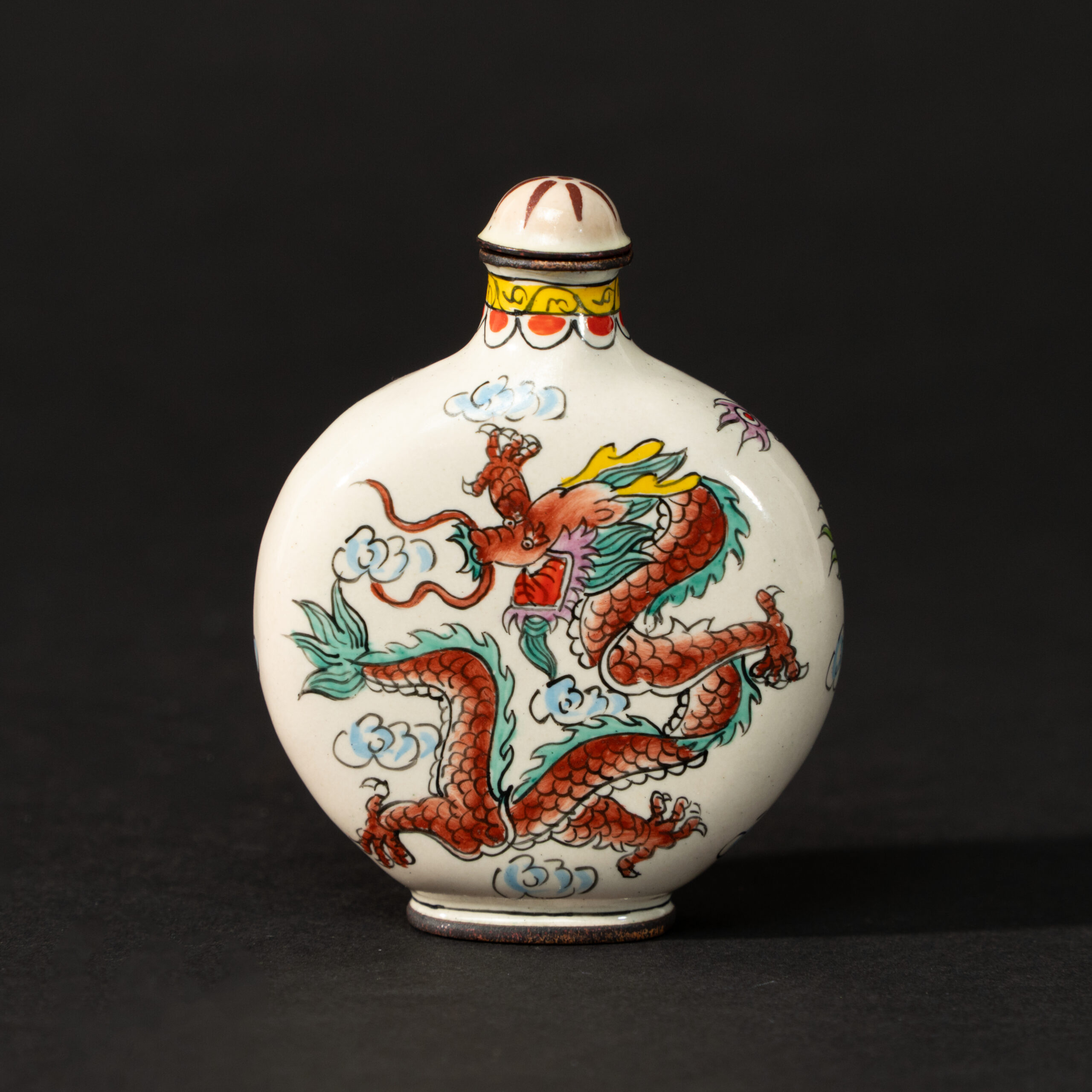 Lot 077 A RARE CANTON ENAMEL 'DRAGON AND CLOUDS' SNUFF BOTTLE
QING DYNASTY