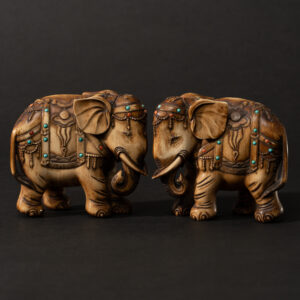 Lot 098 A FINE PAIR OF POLYCHROME-EMBELLISHED 'CAPARISONED ELEPHANT' FIGURES
QING DYNASTY, 19TH CENTURY
