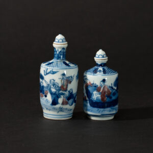 Lot 099 TWO RARE BLUE AND WHITE WITH UNDERGLAZE-COPPER-RED 'EIGHT IMMORTALS' SNUFF BOTTLES
20th Century