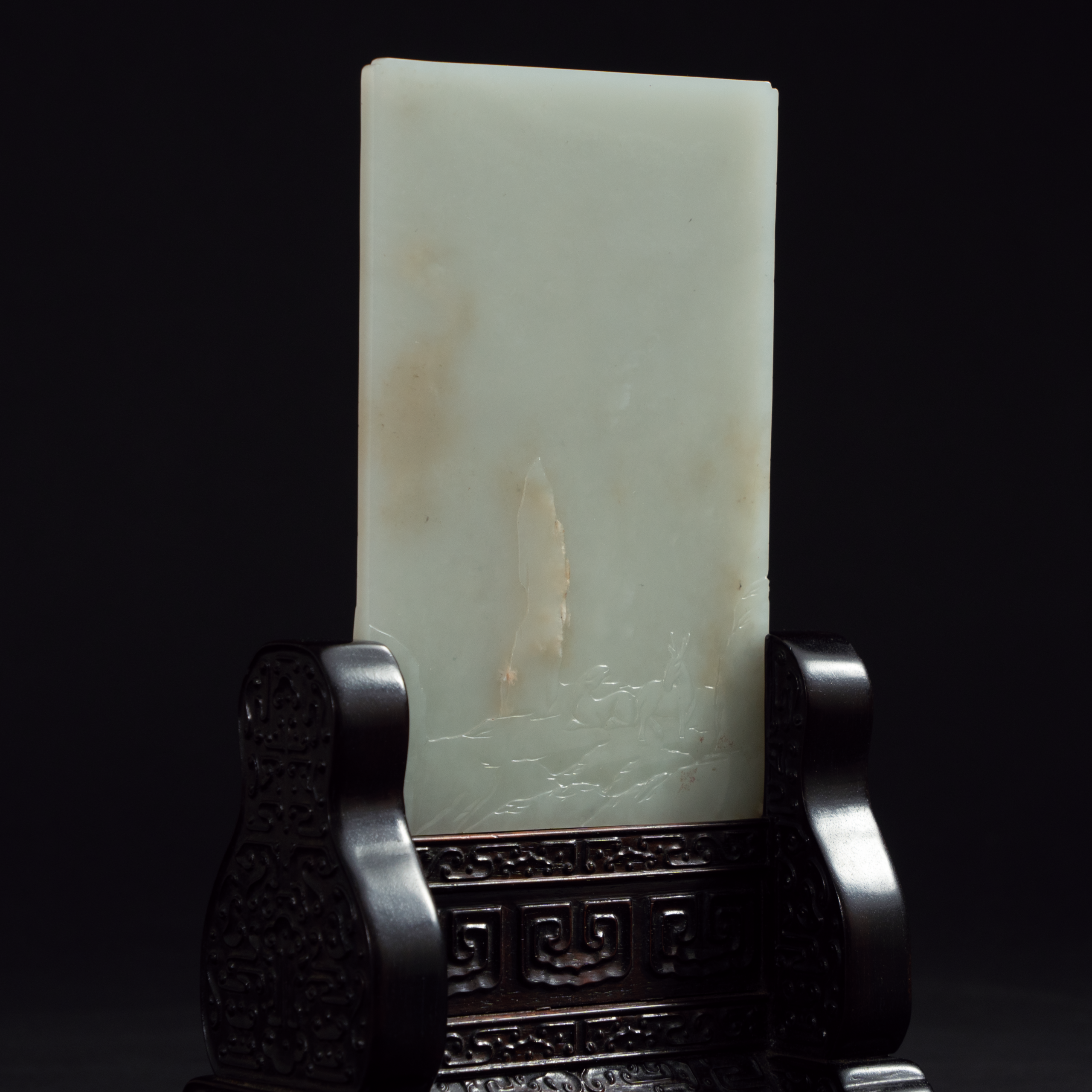 Lot 054 A RARE WHITE JADE 'LANDSCAPE AND POEM' TABLE SCREEN
QING DYNASTY, 18TH - 19TH CENTURY
清代 白玉带皮雕山水人物诗文插屏
