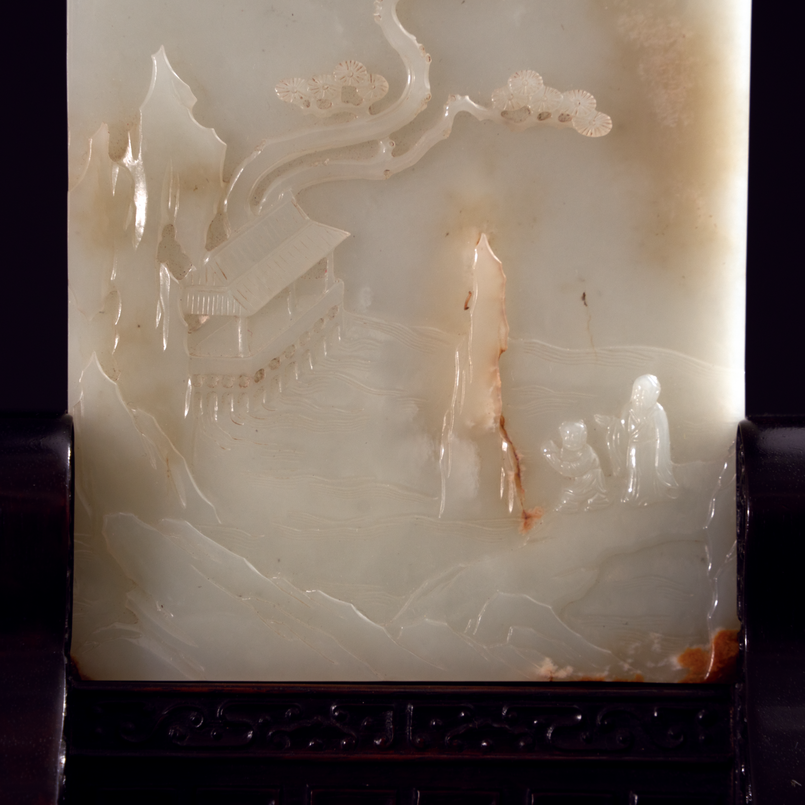 Lot 054 A RARE WHITE JADE 'LANDSCAPE AND POEM' TABLE SCREEN
QING DYNASTY, 18TH - 19TH CENTURY
清代 白玉带皮雕山水人物诗文插屏 - Image 4